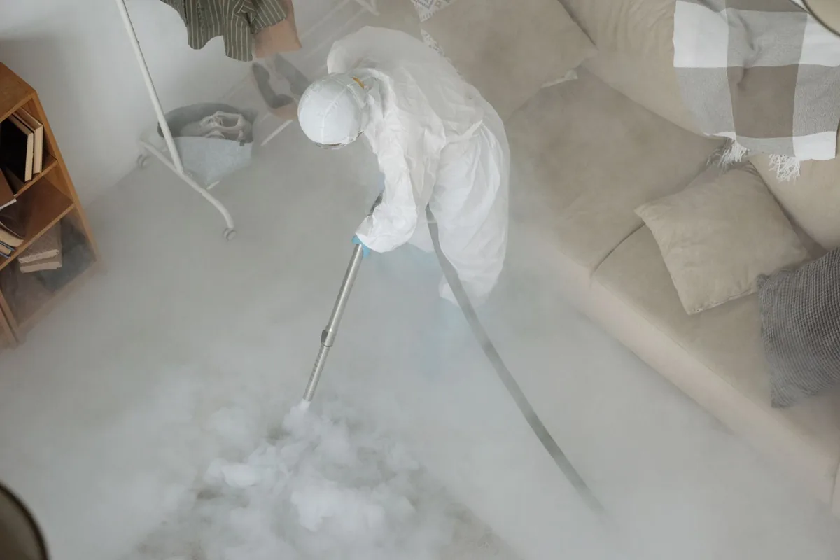Biohazard cleanup technician in protective equipment, Buckner, KY